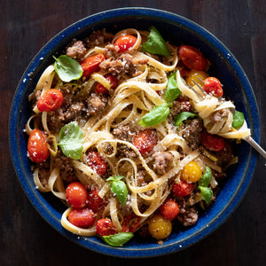 Sausage And Cherry Tomatoes Over Pasta